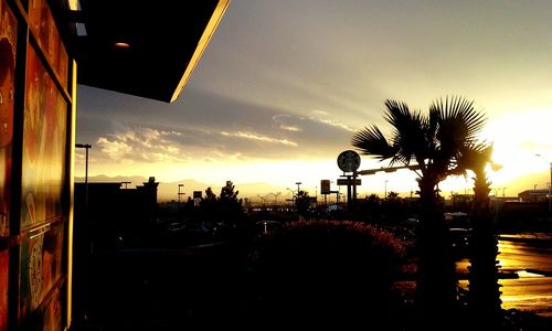 Silhouette of city at sunset