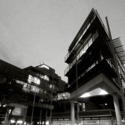 Low angle view of illuminated city against clear sky