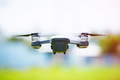 Close-up of airplane flying against sky