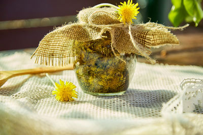 Homemade herbal organic dandelion tincture with wild flowers. dandelion root tincture recipe.