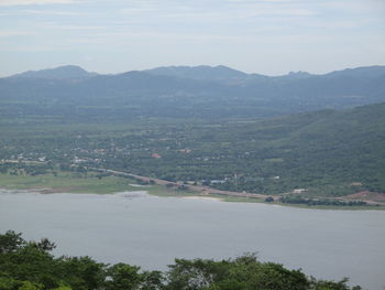 High angle view of trees and mountains against sky