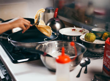 Close-up of man preparing food in kitchen