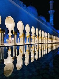 Row of illuminated building in city