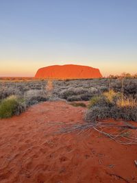 Scenic view of uluru at sunset 