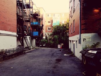 Street amidst buildings in city against sky