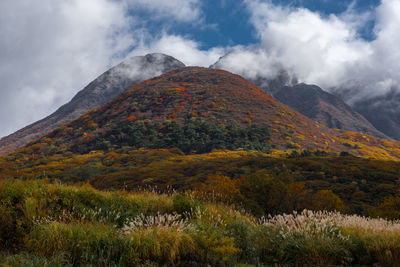 Low angle view of mountain against sky during autumn
