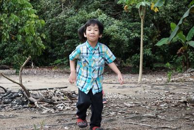 Full length of boy running in park