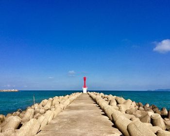 Scenic view of sea against blue sky