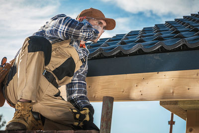 Low angle view of man against sky