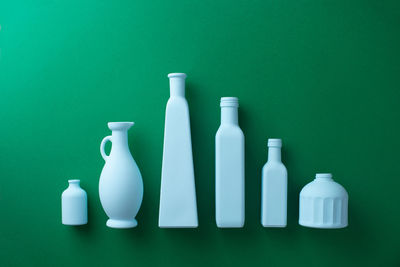 Directly above shot of white bottle against blue background