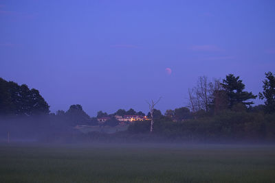 Scenic view of field against sky at night