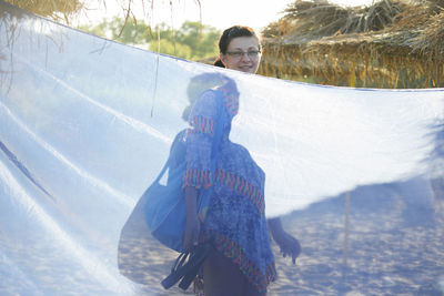 Portrait of smiling woman in snow