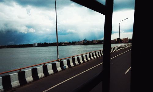 View of bridge against cloudy sky