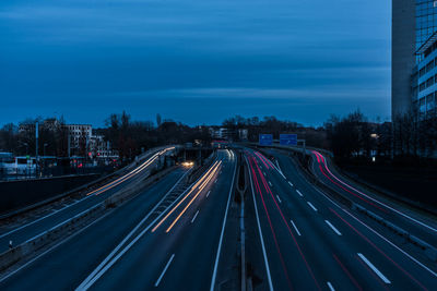 High angle view of light trails on road at night