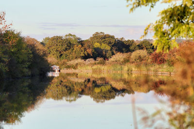 Scenic view of lake against sky during autumn