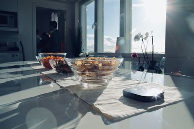 Food on table in glass window