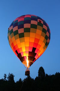 Low angle view of hot air balloon against clear sky