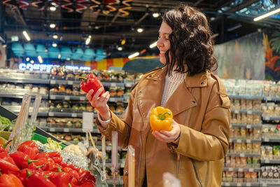 Young woman holding fruits