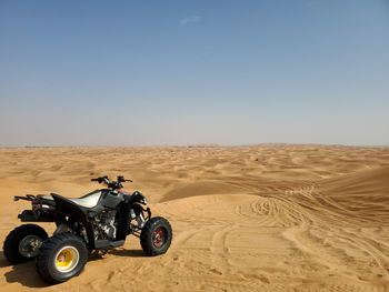 Driving through the sand dunes in dubai