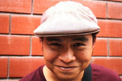 Close-up portrait of smiling mid adult man