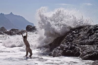 Man jumping on mountain