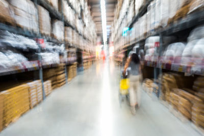 Rear view of man walking in store