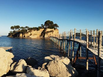 Scenic view of sea against clear blue sky