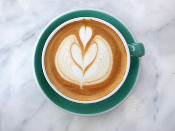High angle view of cappuccino on table