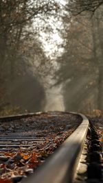 Close-up of railroad track at sunny morning 