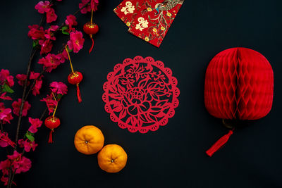 Chinese lunar new year decoration over black background. flat lay concept festive decoration. 