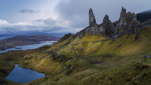 Panoramic view of land and mountains against sky