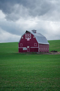 House on field against sky