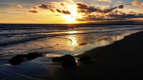 Scenic view of sea against sky during sunset