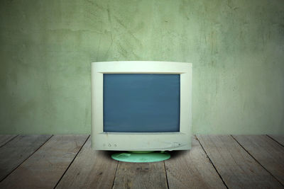 Old wooden table against wall