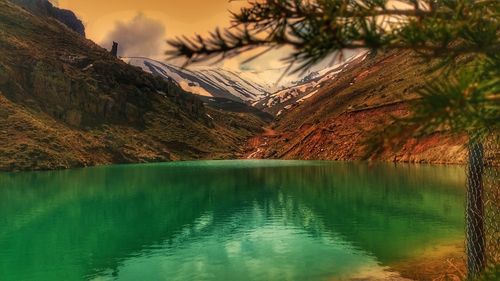 Scenic view of lake against sky during sunset