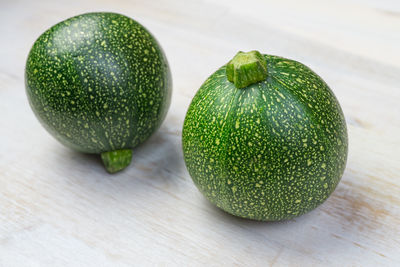 Close-up of green fruits on table