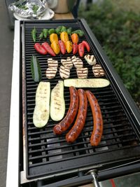 High angle view of meat on barbecue grill