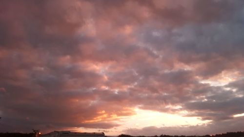 Low angle view of dramatic sky during sunset