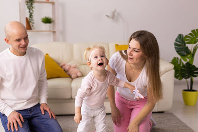 Portrait of family sitting at home