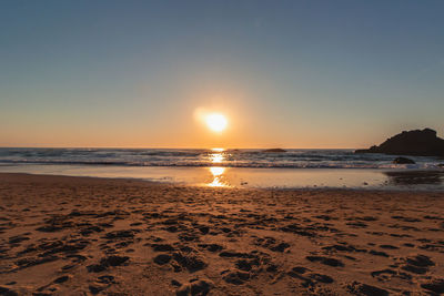 Scenic view of sea against sky during sunset