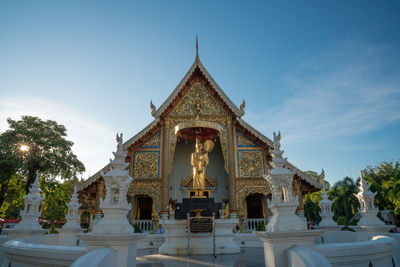 View of temple against building