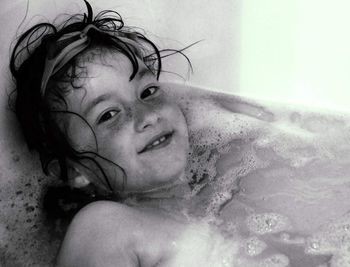 Close-up of child in bath