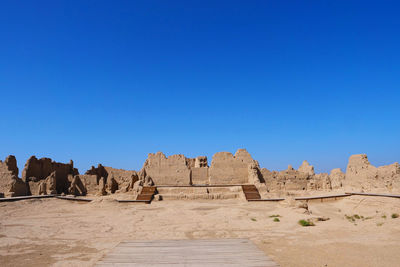 View of castle against clear blue sky