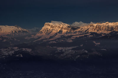 Scenic view of mountains against sky during winter