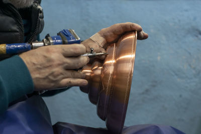 Close-up of man playing guitar