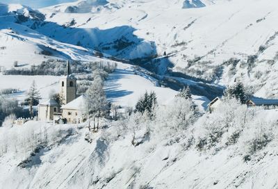 High angle view of snowcapped mountains against sky