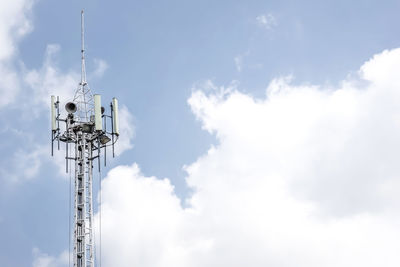 Low angle view of communications tower against sky