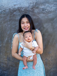 Woman and baby asian and nationality thai is happy feel