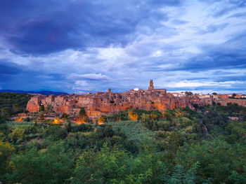 View of landscape against cloudy sky of city of pitigliano in italy 