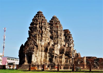 View of temple against clear blue sky